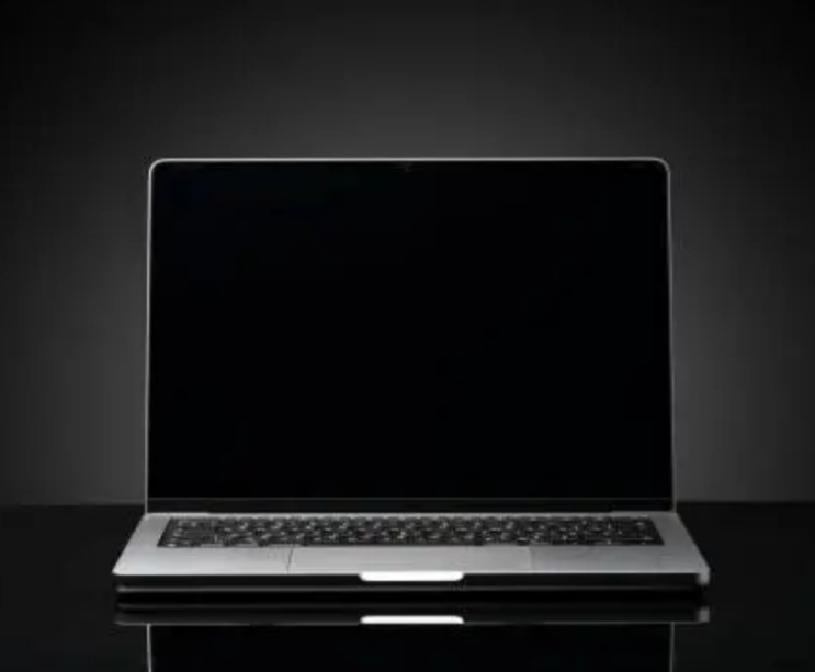 A budget laptop under $500 on display with a dark background.