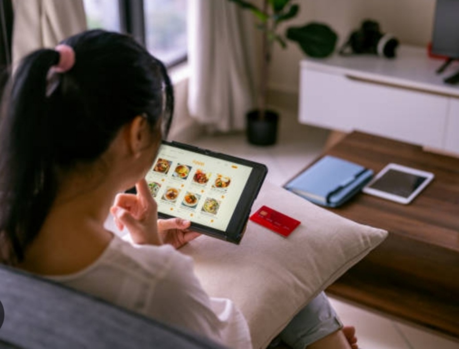 best tablets of 2025 - a woman sitting in her living room with her tablet